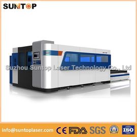 Cina 2000W Fiber Laser Cutting machine with exchanger working table , laser protection cabinet pemasok